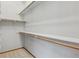 Walk-in closet with white walls and wooden racks at 53 Taylor Ct, Castle Rock, CO 80104