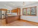 Well-lit kitchen featuring stainless steel refrigerator, wooden cabinets, and a kitchen island at 53 Taylor Ct, Castle Rock, CO 80104