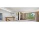 Bright and airy living area featuring built-in bookshelves, large windows, and soft natural light at 53 Taylor Ct, Castle Rock, CO 80104