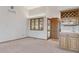 Open-concept living room featuring a bar area with wooden cabinets and a cozy window at 53 Taylor Ct, Castle Rock, CO 80104