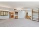 Spacious living space with a wet bar and built-in bookcases, perfect for entertaining and relaxation at 53 Taylor Ct, Castle Rock, CO 80104