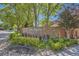 A stone monument sign surrounded by manicured landscaping welcomes you to Tamarac Hills at 7500 E Dartmouth Ave # 22, Denver, CO 80231
