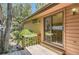 A cozy deck area with wooden stairs leading to the yard at 7500 E Dartmouth Ave # 22, Denver, CO 80231