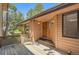 Inviting entryway with wood door, and decorative sconces, and wooden deck at 7500 E Dartmouth Ave # 22, Denver, CO 80231