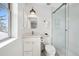 Clean bathroom features white vanity, glass-door shower, and natural lighting at 1644 S Lafayette St, Denver, CO 80210