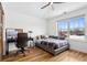Bright bedroom with hardwood floors, neutral decor, and a large window at 1644 S Lafayette St, Denver, CO 80210