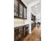 Convenient butler's pantry featuring built-in cabinets, a wine fridge, and a microwave at 1644 S Lafayette St, Denver, CO 80210