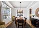 Elegant dining room featuring tray ceilings, hardwood floors, and a large window for natural light at 1644 S Lafayette St, Denver, CO 80210