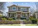 Charming two-story home with stone accents, lush landscaping, and inviting front porch, perfect for curb appeal at 1644 S Lafayette St, Denver, CO 80210