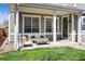 Inviting front porch with comfortable seating, a coffee table, and a well-maintained lawn at 1644 S Lafayette St, Denver, CO 80210