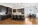 Bright kitchen with a large island, stainless steel appliances, and dark wood cabinets at 1644 S Lafayette St, Denver, CO 80210