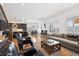 Bright living room and kitchen in an open-concept layout with hardwood floors and plenty of natural light at 1644 S Lafayette St, Denver, CO 80210