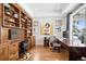 Spacious office featuring custom built-in shelves, hardwood floors, and large windows at 1644 S Lafayette St, Denver, CO 80210