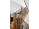 Stylish staircase with wooden railing and black wrought iron balusters and hardwood steps at 1644 S Lafayette St, Denver, CO 80210