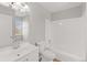 Clean bathroom with white vanity and tub at 13633 E Yale Ave # B, Aurora, CO 80015