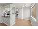Bright dining area with wood floors, connected to a kitchen featuring stainless steel appliances and white cabinetry at 13633 E Yale Ave # B, Aurora, CO 80015