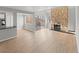 Open living room with a stone fireplace, hardwood floors, and sliding glass doors to outdoor balcony at 13633 E Yale Ave # B, Aurora, CO 80015