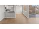 Open living space with hardwood floors and view of outdoor deck at 13633 E Yale Ave # B, Aurora, CO 80015