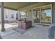 Covered back patio with a dining table set, a view of the yard, and easy access to the house at 12628 Bayshore St, Firestone, CO 80504