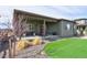 Covered patio and landscaped backyard perfect for outdoor living at 12628 Bayshore St, Firestone, CO 80504