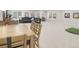 Spacious finished basement featuring a dining area, living area, and a golf simulator at 12628 Bayshore St, Firestone, CO 80504