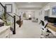 Spacious finished basement with an office area, stairs, and living area for relaxing and working at 12628 Bayshore St, Firestone, CO 80504