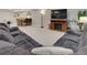 Cozy finished basement with a comfortable seating area, a fireplace, and a dining table at 12628 Bayshore St, Firestone, CO 80504