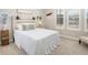 A well-lit bedroom features neutral tones, a decorative headboard, and a comfortable bed with soft pillows and cozy decor accents at 12628 Bayshore St, Firestone, CO 80504