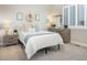 Serene bedroom with a comfortable bed, neutral decor, and a window with plantation shutters, creating a cozy and inviting space at 12628 Bayshore St, Firestone, CO 80504