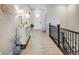 Bright entryway featuring wood floors, a staircase, and decorative accents at 12628 Bayshore St, Firestone, CO 80504