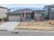 Charming single-Gathering home with a two-car garage and well-maintained front yard at 12628 Bayshore St, Firestone, CO 80504