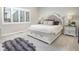 Comfortable main bedroom with a stylish bed frame and ample natural light at 12628 Bayshore St, Firestone, CO 80504