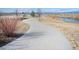 Scenic community walking path along the water, perfect for a leisurely stroll at 12628 Bayshore St, Firestone, CO 80504