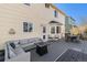 This backyard features a wooden deck with furniture, grass, wood fence, and yellow-painted walls at 6184 Clayton St, Frederick, CO 80530