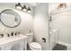 Bathroom featuring modern fixtures, a stylish vanity, and a laundry area at 6184 Clayton St, Frederick, CO 80530
