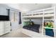 This bedroom features a set of bunk beds, a dresser, carpet and a window with blinds at 6184 Clayton St, Frederick, CO 80530
