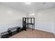 Finished basement room with corner desk and built-in shelving at 9210 Yucca Way, Thornton, CO 80229