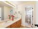 Bright bathroom with double sinks and a mirror at 10633 Wynspire Way, Highlands Ranch, CO 80130