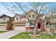 Charming two-story home with a well-manicured lawn and a welcoming front entrance at 10633 Wynspire Way, Highlands Ranch, CO 80130