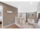 Upstairs hallway with natural light, views to living areas, and access to bedrooms at 10633 Wynspire Way, Highlands Ranch, CO 80130