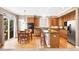 Open-concept kitchen features a breakfast nook, stainless steel appliances, and ample cabinets at 10633 Wynspire Way, Highlands Ranch, CO 80130