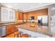 Spacious kitchen features granite countertops, stainless steel appliances, and a breakfast bar at 10633 Wynspire Way, Highlands Ranch, CO 80130