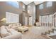 Bright living room with soaring ceilings and lots of windows at 10633 Wynspire Way, Highlands Ranch, CO 80130