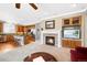 Open-concept living area seamlessly connects the kitchen and living room, featuring a fireplace at 10633 Wynspire Way, Highlands Ranch, CO 80130
