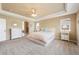Beautiful main bedroom features a tray ceiling and ensuite bath at 10633 Wynspire Way, Highlands Ranch, CO 80130