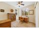 Well-lit office features natural light, a ceiling fan, and built-in bookcase at 10633 Wynspire Way, Highlands Ranch, CO 80130