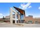 Modern community recreation center with stone and wood architecture with an American flag out front at 10633 Wynspire Way, Highlands Ranch, CO 80130