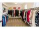 Spacious walk-in closet with ample storage and organization system at 10633 Wynspire Way, Highlands Ranch, CO 80130