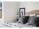 Close up of a bed in a modern bedroom featuring gray pillows and stylish decor at 11640 W 13Th Ave, Lakewood, CO 80401