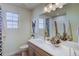 Modern bathroom with a large mirror, vanity with sink, and decorative accents at 1200 Sugarloaf Ln, Erie, CO 80516